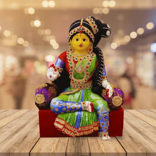 Varamahalakshmi Idol With Ornaments in Green And Red Saree